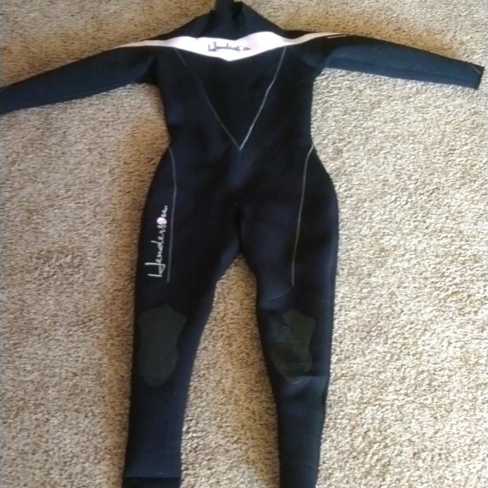 Henderson wetsuit with light pink accents.